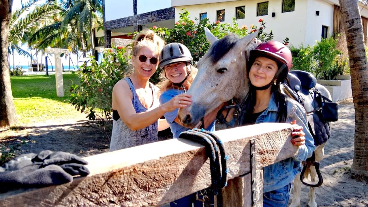 Tequilla with people at What A Rush Riding Stables